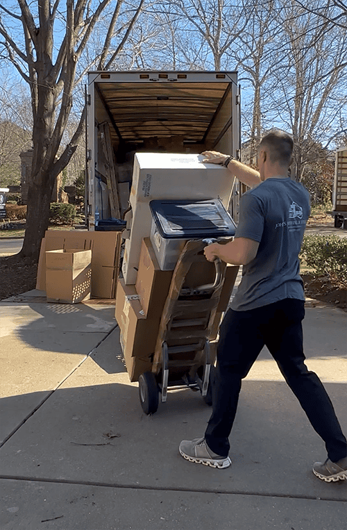 John's Moving and Storage local movers loading a truck in Raleigh NC