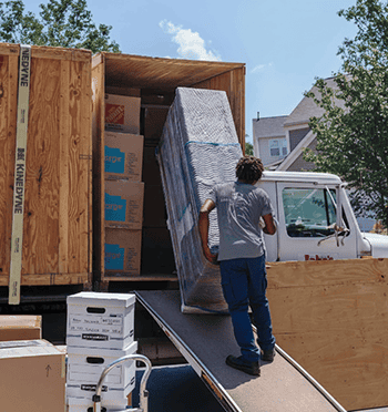 Commercial moving crew loading crates for a business move